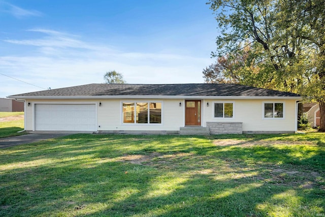 single story home featuring a garage and a front lawn