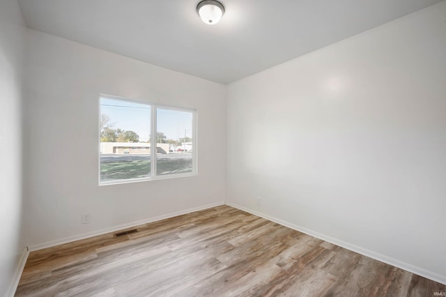 unfurnished room featuring light wood-type flooring