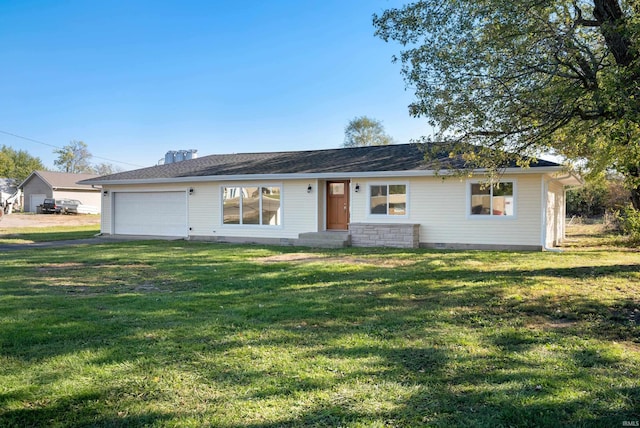 single story home with a front yard and a garage