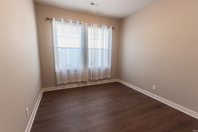 3088 Ashdon Dr, Newburgh, IN 47630 - empty room with baseboards, dark wood-type flooring, and visible vents