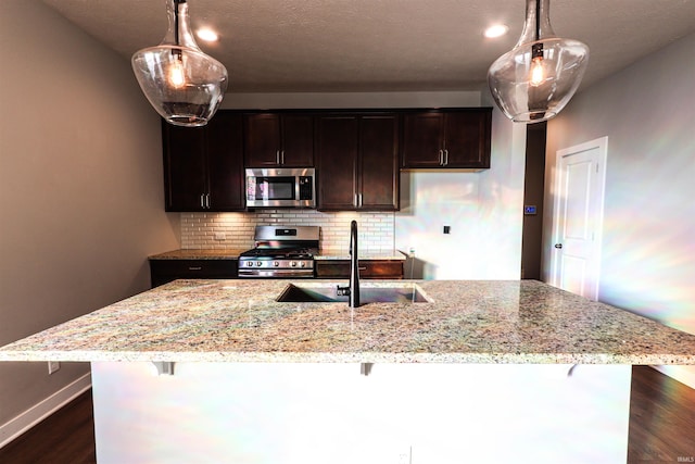 3088 Ashdon Dr, Newburgh, IN 47630 - kitchen featuring light stone counters, a sink, decorative backsplash, dark wood-type flooring, and stainless steel appliances