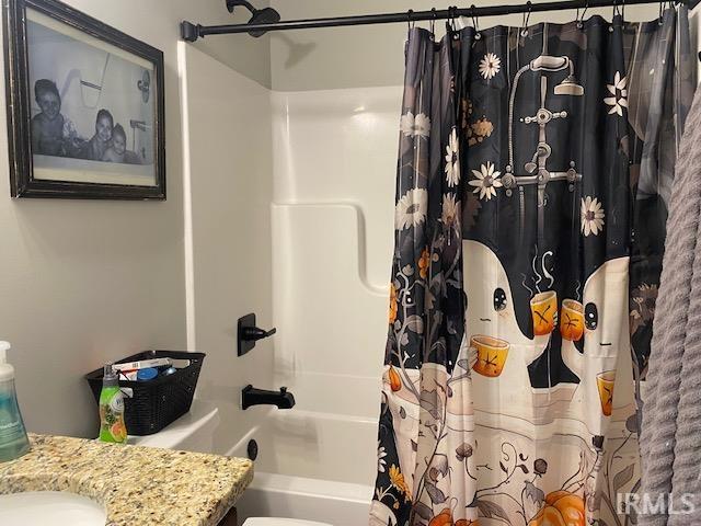 bathroom with vanity and shower / bath combo