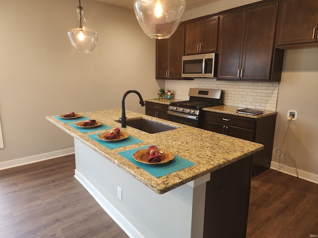 3088 Ashdon Dr, Newburgh, IN 47630 - kitchen with a sink, dark brown cabinetry, dark wood finished floors, baseboards, and appliances with stainless steel finishes