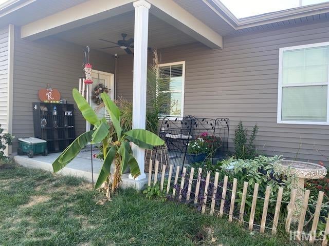 exterior space with ceiling fan