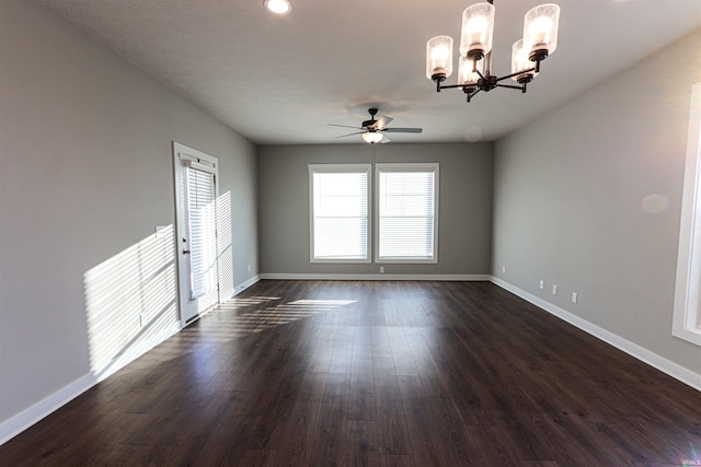 3088 Ashdon Dr, Newburgh, IN 47630 - unfurnished room with ceiling fan with notable chandelier, baseboards, and dark wood-type flooring