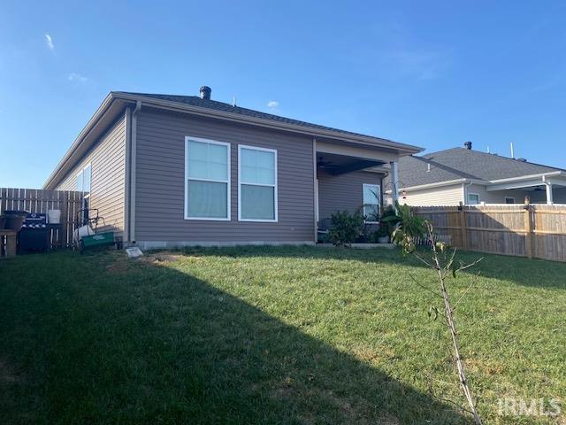 3088 Ashdon Dr, Newburgh, IN 47630 - rear view of house with a yard and fence