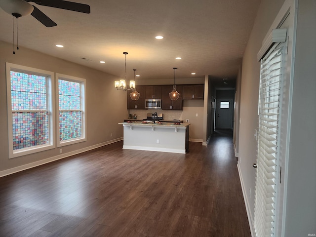 3088 Ashdon Dr, Newburgh, IN 47630 - kitchen with a ceiling fan, backsplash, recessed lighting, and stainless steel microwave