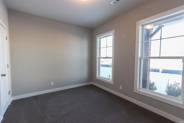 3088 Ashdon Dr, Newburgh, IN 47630 - spare room featuring dark colored carpet and baseboards