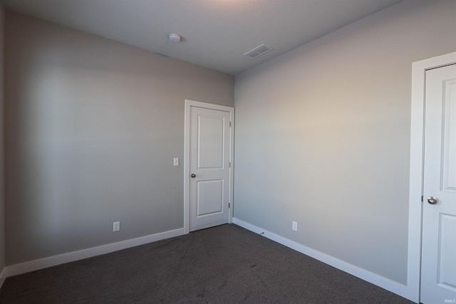 3088 Ashdon Dr, Newburgh, IN 47630 - unfurnished room with dark colored carpet, baseboards, and visible vents