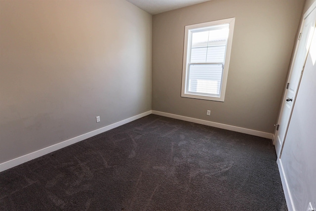 3088 Ashdon Dr, Newburgh, IN 47630 - unfurnished room with baseboards and dark carpet