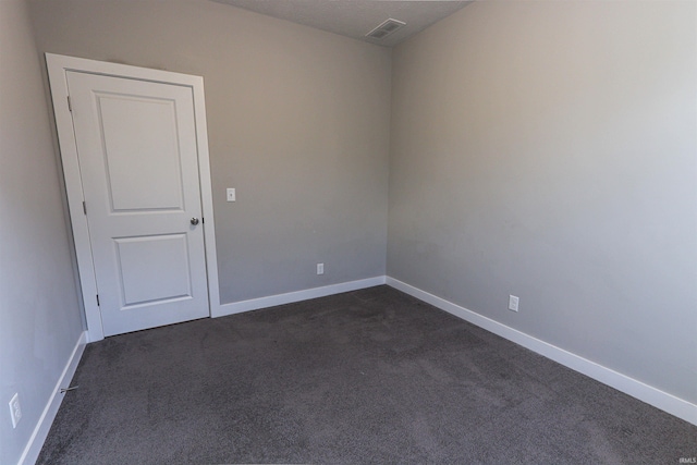 3088 Ashdon Dr, Newburgh, IN 47630 - empty room featuring baseboards, dark colored carpet, and visible vents