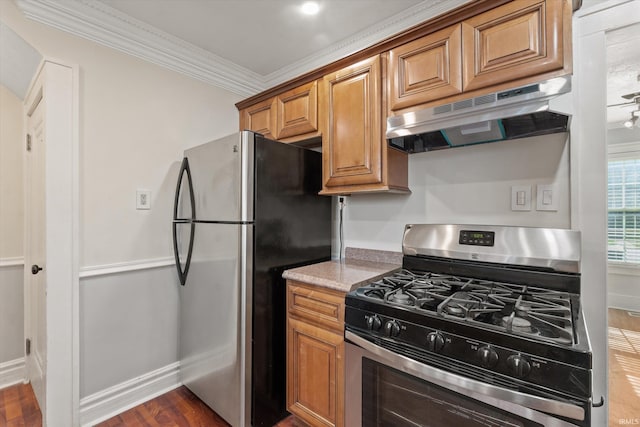 kitchen with crown molding, light stone countertops, stainless steel appliances, and dark wood-type flooring