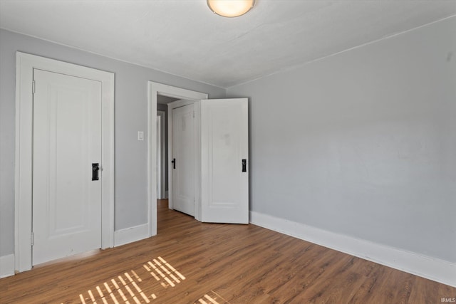 unfurnished bedroom featuring hardwood / wood-style floors