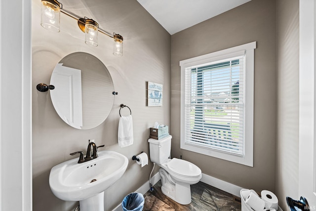 bathroom featuring toilet and sink