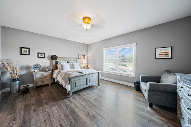 bedroom featuring dark wood-type flooring and ceiling fan