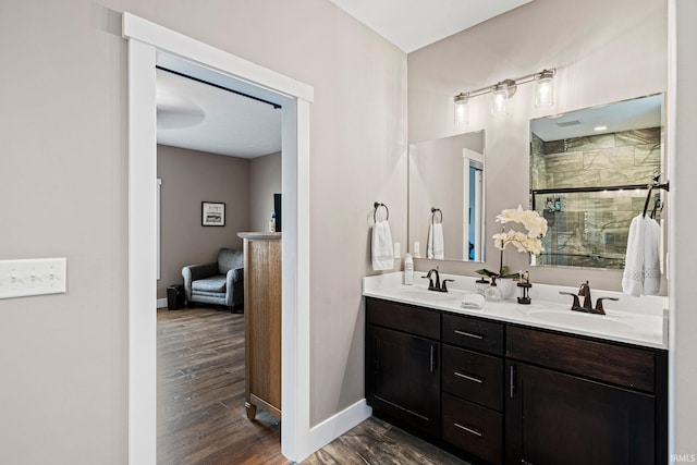 bathroom featuring vanity, hardwood / wood-style flooring, and walk in shower