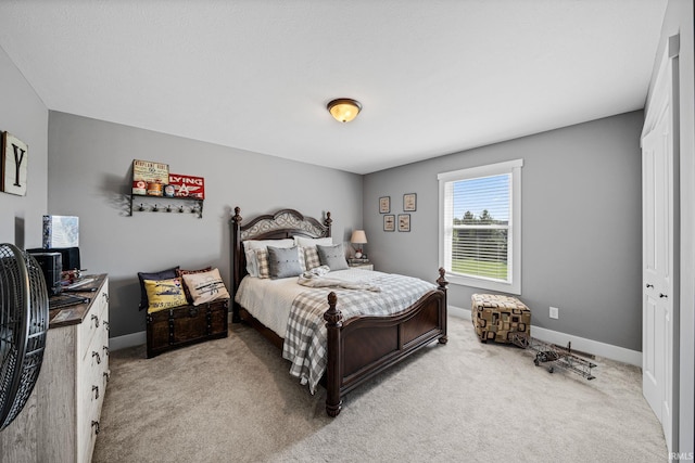 carpeted bedroom featuring a closet