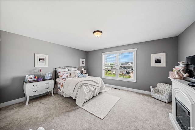 bedroom featuring light carpet