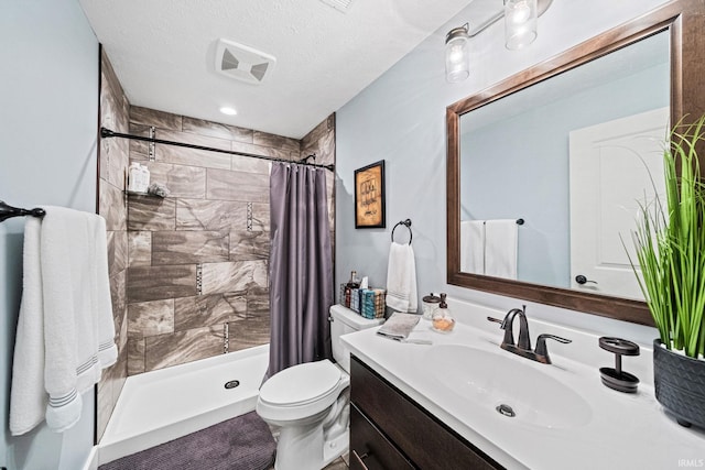 bathroom with toilet, a textured ceiling, vanity, and a shower with shower curtain