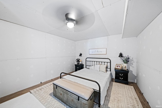 bedroom featuring ceiling fan and hardwood / wood-style flooring