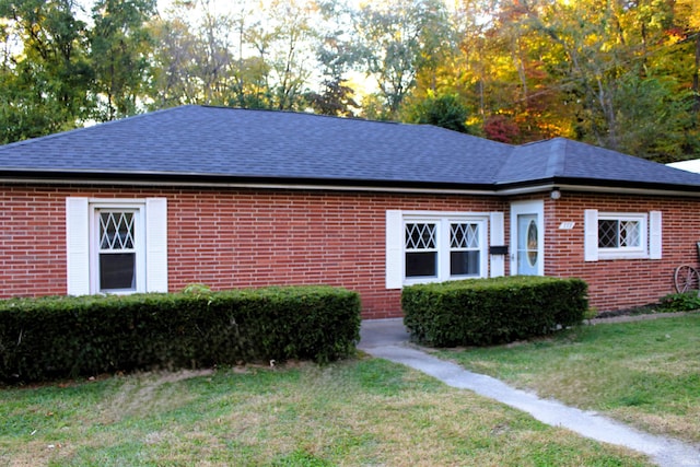 view of property exterior with a yard