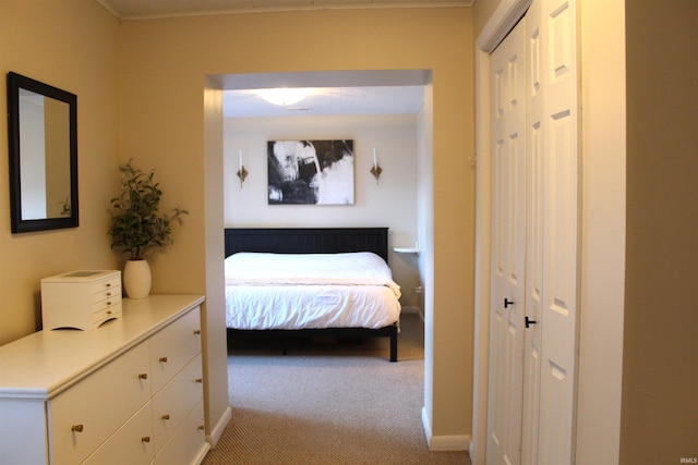 carpeted bedroom featuring a closet