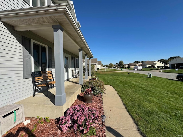 exterior space with a yard and covered porch