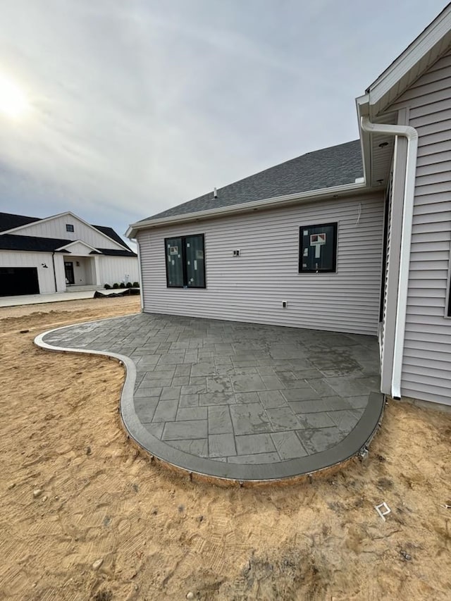 back of property featuring a patio area