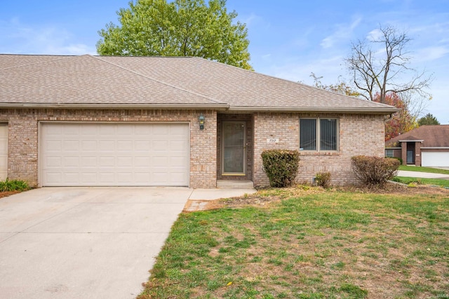 ranch-style home with a front lawn and a garage