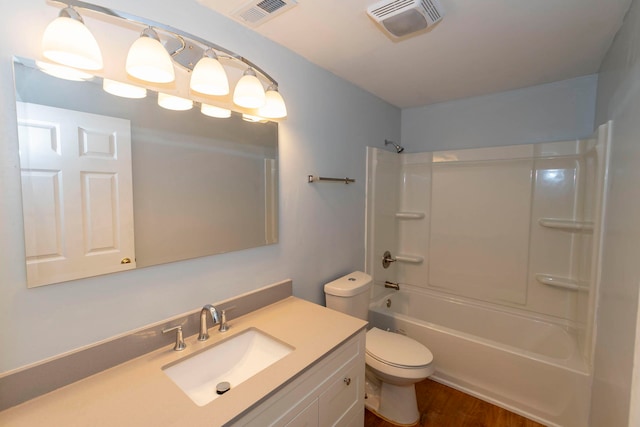 full bathroom featuring vanity, wood-type flooring, toilet, and shower / bath combination