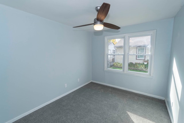 spare room featuring carpet flooring and ceiling fan