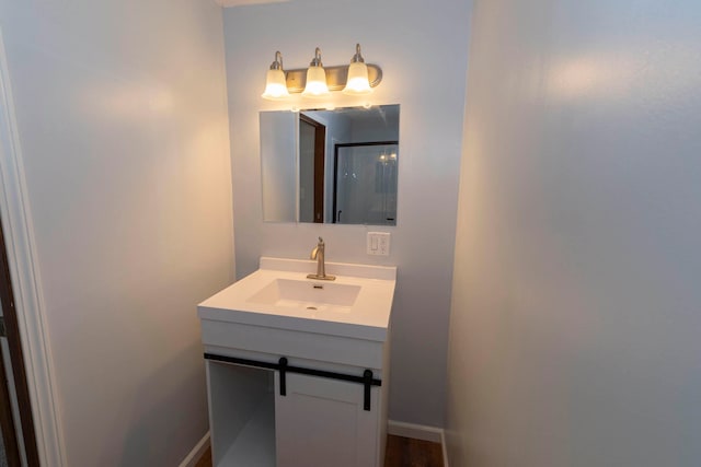 bathroom featuring vanity and a shower