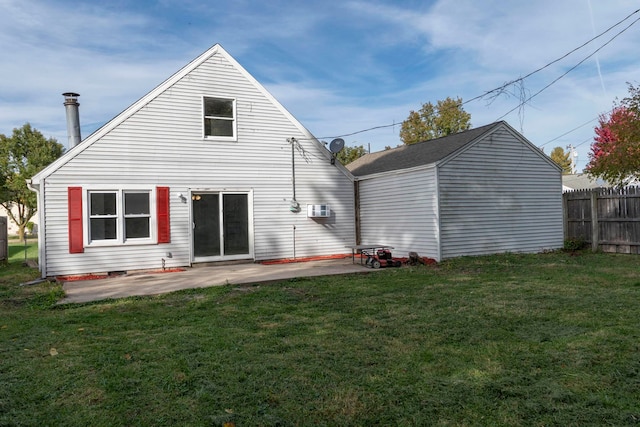 back of house with a patio area and a yard