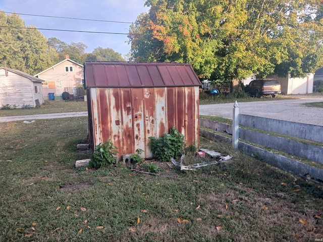 view of outbuilding with a yard