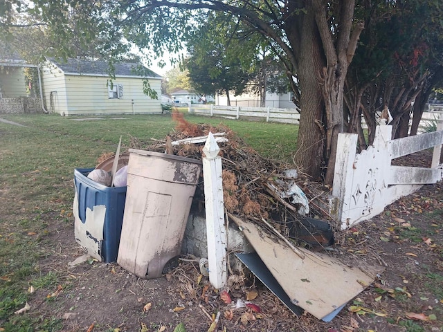 entry to storm shelter featuring a lawn