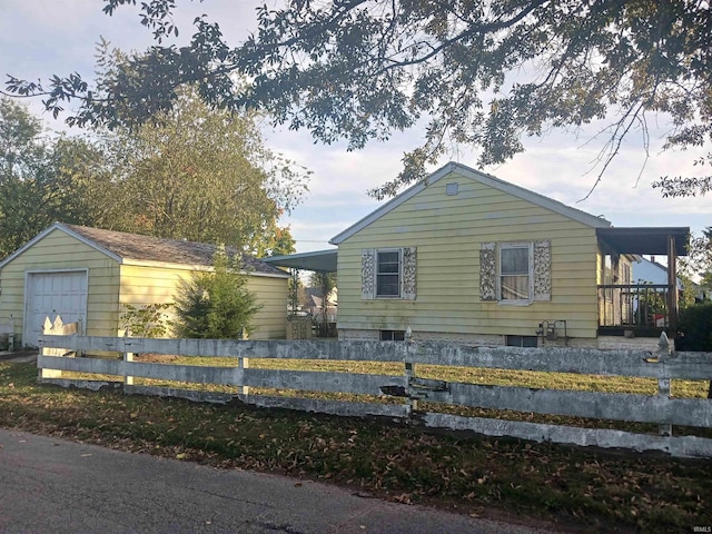 view of side of home with an outbuilding and a garage