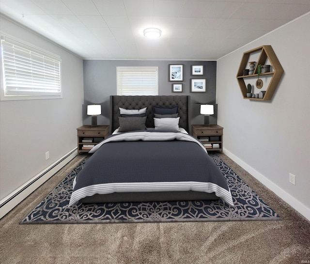 bedroom featuring multiple windows, baseboard heating, and carpet