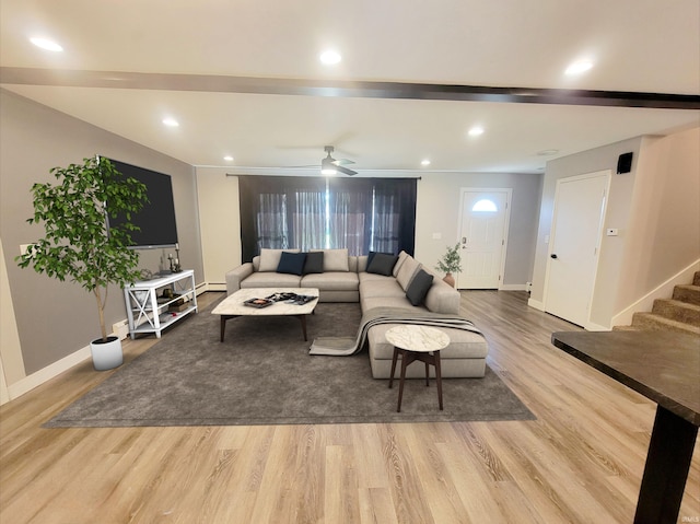 living room with light hardwood / wood-style flooring, ornamental molding, a healthy amount of sunlight, and ceiling fan