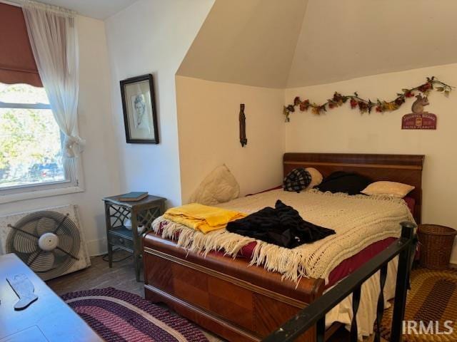 bedroom featuring lofted ceiling