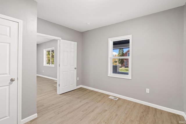 unfurnished room featuring light wood-type flooring