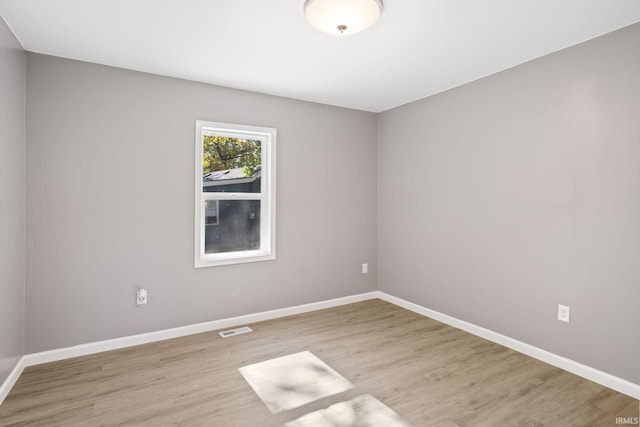 empty room with light wood-type flooring