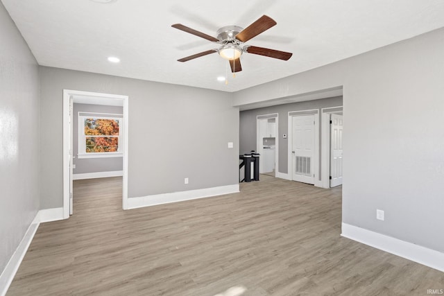 unfurnished living room with light hardwood / wood-style floors and ceiling fan