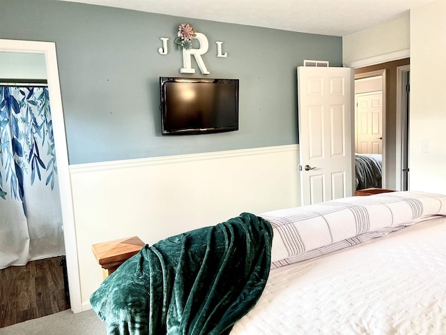 bedroom with carpet and a closet