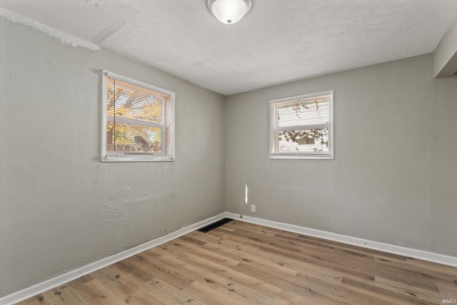 unfurnished room featuring light wood-type flooring