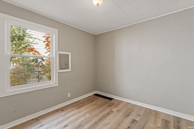 empty room with light hardwood / wood-style floors