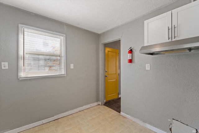 interior space with a textured ceiling