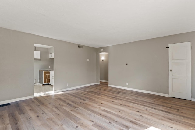 unfurnished room featuring light hardwood / wood-style floors