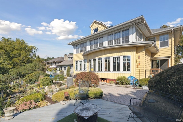 back of property with a patio