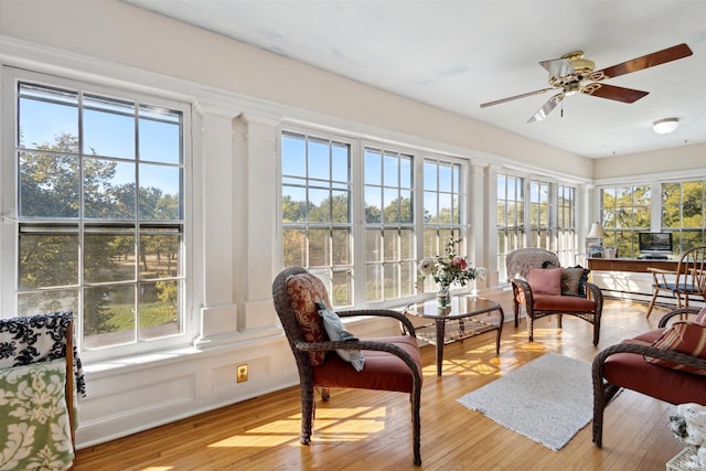 sunroom featuring plenty of natural light and ceiling fan