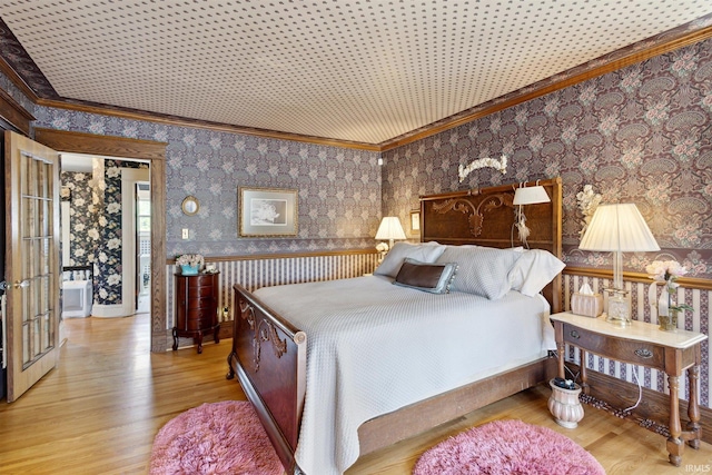 bedroom with ornamental molding and light wood-type flooring